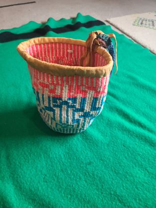 Plateau twined yarn round bag ("sally bag" form) with buckskin rim, plate 16