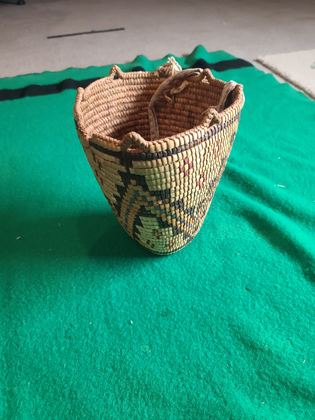 Fully imbricated polychrome Klickitat-type huckleberry basket with cloth-bound rim and cotton tumpline, plate 188