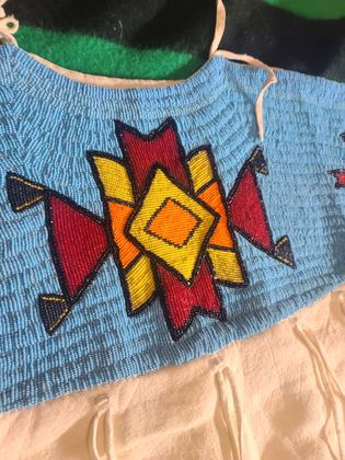 Beaded-yoke buckskin dress, light blue lane-stitch ground, plate 3