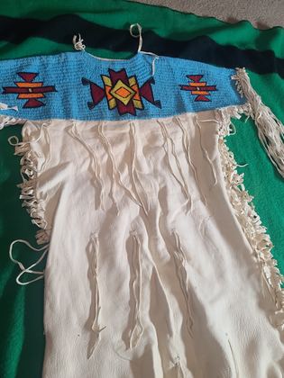 Beaded-yoke buckskin dress, light blue lane-stitch ground, plate 5